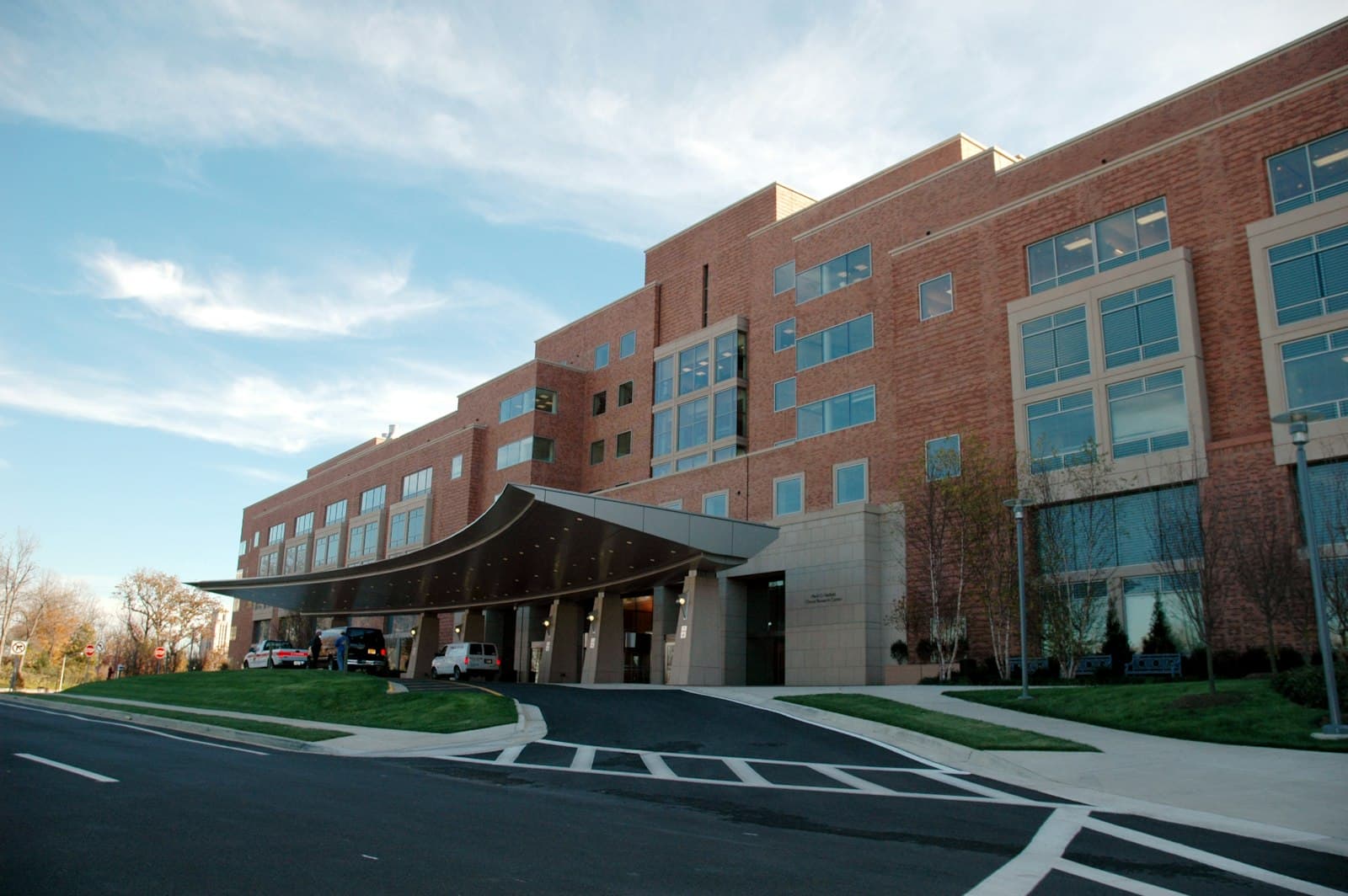 Brick hospital building with covered main entrance