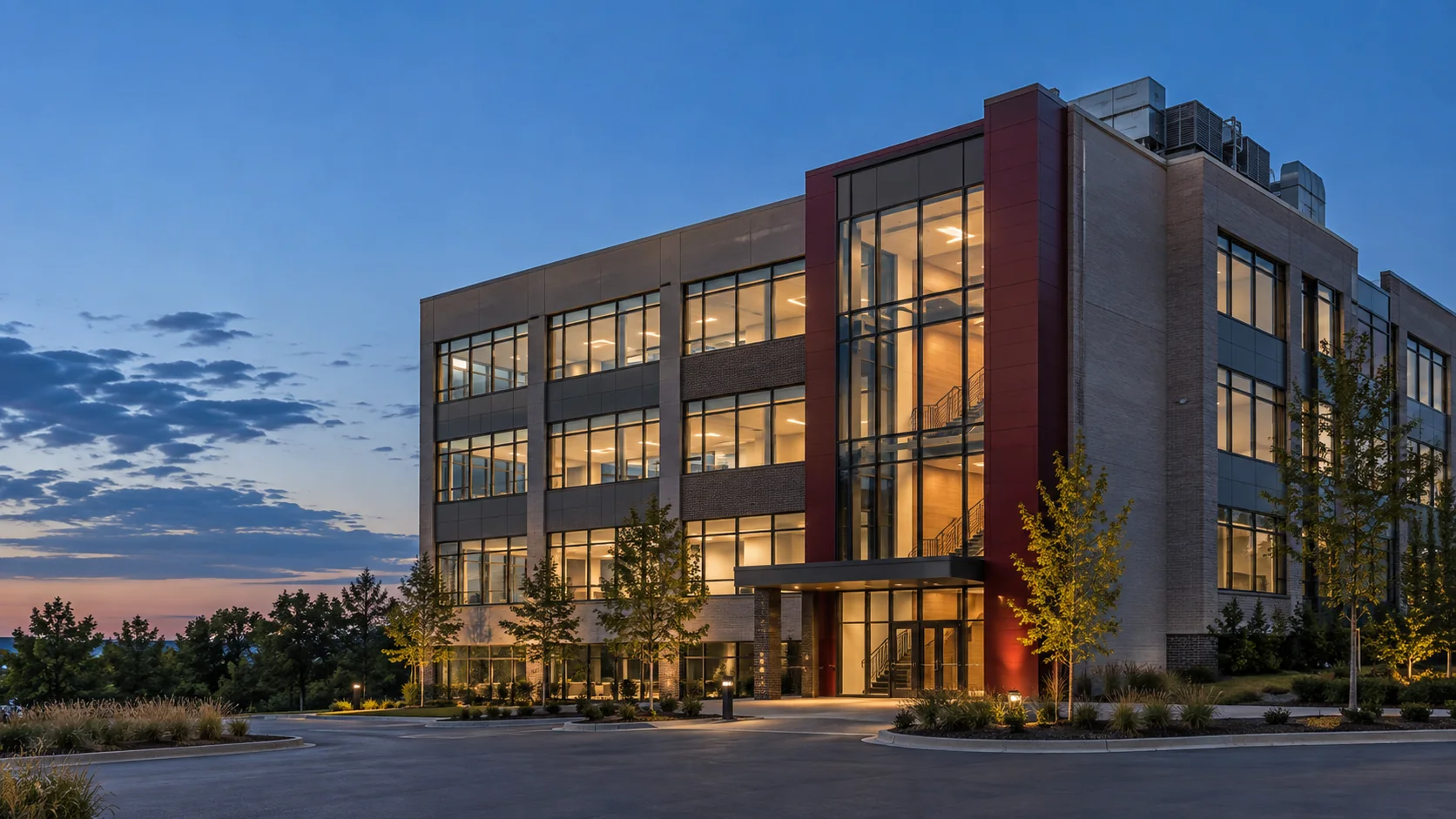 Architectural illustration of the Soma building at dusk, with illuminated interiors and rooftop equipment